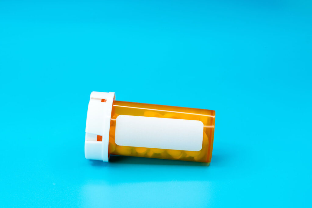 a pill bottle containing either ativan or xanax on its side